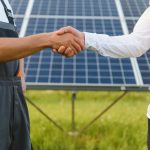 Shaking hands of engineers after the conclusion of the agreement in the renewable energy